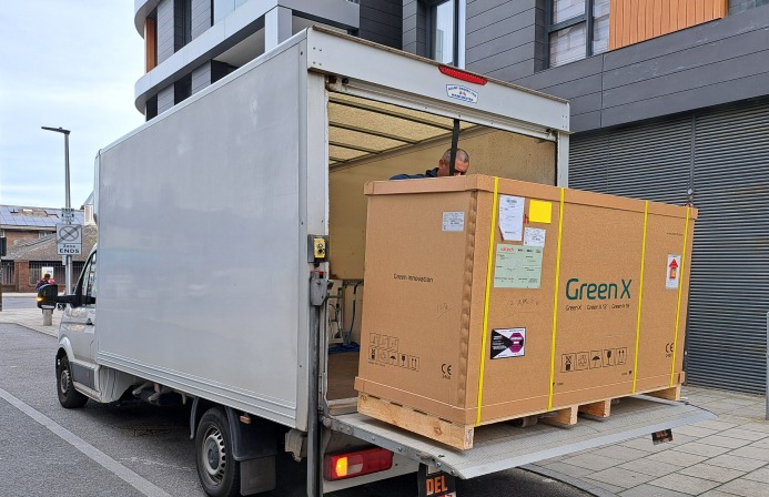 Rother Removals delivering a crated item from the Luton van